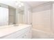 Bright bathroom featuring a tub/shower combo, vanity, and a large mirror at 3014 Castleberry Ct, Charlotte, NC 28209