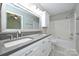 Bathroom boasts a double sink vanity, large mirror, and a shower-tub combination at 3014 Castleberry Ct, Charlotte, NC 28209