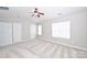 Bedroom features plush carpet, neutral walls, ceiling fan, and multiple closets at 3014 Castleberry Ct, Charlotte, NC 28209