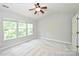 Bedroom with a ceiling fan, plush carpet, and lots of natural light at 3014 Castleberry Ct, Charlotte, NC 28209