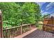 Wooden deck offers a tranquil spot to enjoy the surrounding trees and sky at 3014 Castleberry Ct, Charlotte, NC 28209