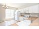 Bright kitchen featuring white cabinets and tile flooring at 3014 Castleberry Ct, Charlotte, NC 28209