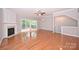 Open living room featuring a fireplace and access to the outdoor deck at 3014 Castleberry Ct, Charlotte, NC 28209