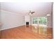 Spacious living room with hardwood floors, a fireplace, and sliding doors to the backyard at 3014 Castleberry Ct, Charlotte, NC 28209
