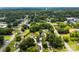 Overhead shot shows property surrounded by trees and neighborhood; water tower is seen in distance at 310 S Jacob St, Cherryville, NC 28021