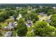 The property is shown from above, surrounded by mature trees and neighboring houses at 310 S Jacob St, Cherryville, NC 28021