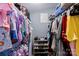 Walk-in closet featuring clothes on hangers, shoe storage, and neutral walls at 310 S Jacob St, Cherryville, NC 28021
