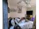 Bedroom with ceiling fan, artwork, and neutral wall color at 3241 Reid Ave, Charlotte, NC 28208