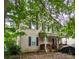 Charming two-story home with a cozy front porch and mature trees at 3241 Reid Ave, Charlotte, NC 28208