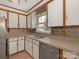 Functional kitchen with stainless dishwasher, double sink and ample cabinet space at 3408 Oak Tree Trl, Matthews, NC 28105