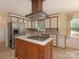 Spacious kitchen featuring a center island cooktop, stainless steel appliances, and ample cabinetry at 3408 Oak Tree Trl, Matthews, NC 28105