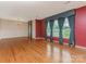 Bright living room with hardwood flooring, chandelier, and large windows at 3408 Oak Tree Trl, Matthews, NC 28105