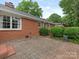 Brick patio with classic herringbone pattern offers great space for outdoor living and entertaining at 3408 Oak Tree Trl, Matthews, NC 28105