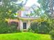 Two-story house with brick and vinyl exterior, well-manicured lawn at 3509 Joel Turner Dr, Charlotte, NC 28216