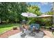 Backyard with a patio set under an umbrella and a gazebo for entertaining at 3702 Brookstone Trl, Indian Trail, NC 28079
