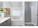 Bright bathroom featuring a shower/tub combo and gray vanity with light countertop at 3702 Brookstone Trl, Indian Trail, NC 28079