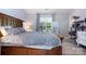 Comfortable bedroom featuring a large bed, modern decor, and serene ambiance at 3702 Brookstone Trl, Indian Trail, NC 28079