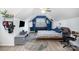 Stylish attic bedroom featuring a modern desk, chair, and a blue accent wall at 3702 Brookstone Trl, Indian Trail, NC 28079