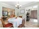 Bright dining room with natural light, chandelier lighting, and open flow to the living room and kitchen at 3702 Brookstone Trl, Indian Trail, NC 28079
