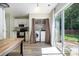 Kitchen area featuring laundry closet, stainless appliances, and sliding glass doors to backyard at 3702 Brookstone Trl, Indian Trail, NC 28079