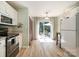 Open kitchen/dining area with stainless appliances and sliding door access to outdoor patio at 3702 Brookstone Trl, Indian Trail, NC 28079