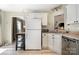 Bright kitchen with white cabinets, stainless steel dishwasher, and a butcher block island at 3702 Brookstone Trl, Indian Trail, NC 28079