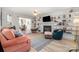 Bright living room with built-in bookshelves, a fireplace, and neutral tones perfect for relaxation and entertaining at 3702 Brookstone Trl, Indian Trail, NC 28079