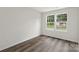 Bright, airy bedroom with two large windows and wood-look floors at 510 3Rd St, Salisbury, NC 28144