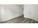 Bedroom featuring wood-look floors, closet, and access to another room at 510 3Rd St, Salisbury, NC 28144