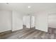 Neutral bedroom features wood-look floors and multiple access doors at 510 3Rd St, Salisbury, NC 28144