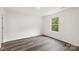 Bedroom boasts natural light and durable wood-look floors at 510 3Rd St, Salisbury, NC 28144