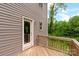 A view of the rear deck with access to the back yard through a glass door at 510 3Rd St, Salisbury, NC 28144