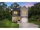 Charming two-story home featuring a gray and white exterior, attached garage and well-maintained landscaping at 510 3Rd St, Salisbury, NC 28144