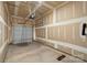 Unfinished two car garage with an automatic door opener and concrete flooring at 510 3Rd St, Salisbury, NC 28144