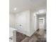 Bright hallway features wood-look floors, closet, and access to other rooms at 510 3Rd St, Salisbury, NC 28144