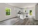 Bright kitchen features white cabinetry, granite countertops, stainless steel appliances, and an island at 510 3Rd St, Salisbury, NC 28144
