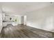 Open-concept living space with a modern kitchen, stainless appliances, island and a door to the backyard at 510 3Rd St, Salisbury, NC 28144