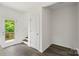 A view from the living area showing the rear entry to the home and the staircase at 510 3Rd St, Salisbury, NC 28144