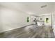 Open-concept living space with a modern kitchen, stainless appliances, island and a door to the backyard at 510 3Rd St, Salisbury, NC 28144