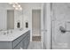 Bright bathroom featuring double sinks, modern fixtures, and a glass shower at 513 Meadow Ridge Dr, Belmont, NC 28012