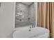 Close up on a soaking tub with a view of the glass shower at 513 Meadow Ridge Dr, Belmont, NC 28012