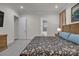 Cozy bedroom showcasing a floral patterned bedspread and ensuite bathroom access at 513 Meadow Ridge Dr, Belmont, NC 28012