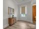 Inviting foyer with a stylish cabinet, decorative mirror, and natural light at 513 Meadow Ridge Dr, Belmont, NC 28012