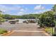 Scenic lake view from the community parking area, with boat docks and lush green surroundings at 513 Meadow Ridge Dr, Belmont, NC 28012