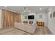 A modern living room with a fireplace, large sofa, TV, recessed lighting, a ceiling fan, and hardwood floors at 513 Meadow Ridge Dr, Belmont, NC 28012