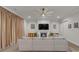 A modern living room with a fireplace, large sofa, TV, recessed lighting, a ceiling fan, and hardwood floors at 513 Meadow Ridge Dr, Belmont, NC 28012