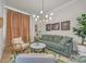 Inviting living room featuring comfortable seating and modern light fixture at 513 Meadow Ridge Dr, Belmont, NC 28012