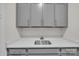 Mudroom featuring gray cabinets, quartz countertops and a stainless steel sink at 513 Meadow Ridge Dr, Belmont, NC 28012