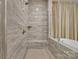 Modern tiled shower showcasing a built-in bench and shower head at 513 Meadow Ridge Dr, Belmont, NC 28012