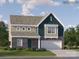New construction two-story home with brick and siding exterior, two-car garage and professionally landscaped front yard at 521 Millstone Dr, Edgemoor, SC 29712